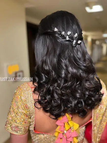 Another angle of the butterfly clip hairstyle, showing the delicate braided detail along the crown.
