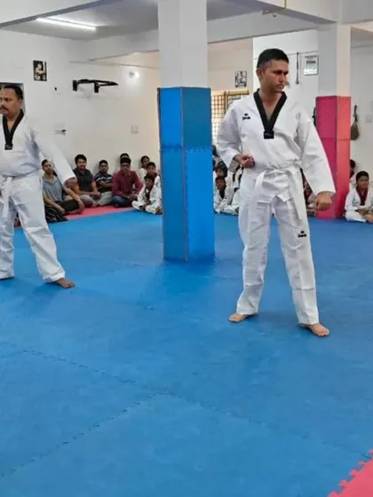 Two senior students in a ready stance.