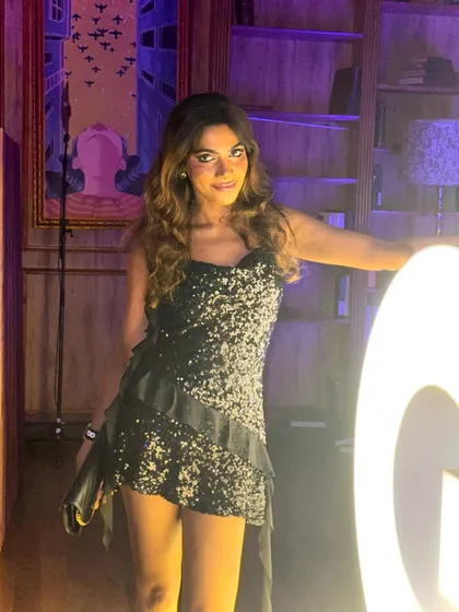 A candid shot from the GQ party, enjoying the glamorous atmosphere.