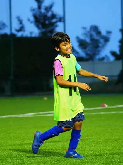 A player celebrates during a training game. We encourage positive energy and enjoyment on the field.