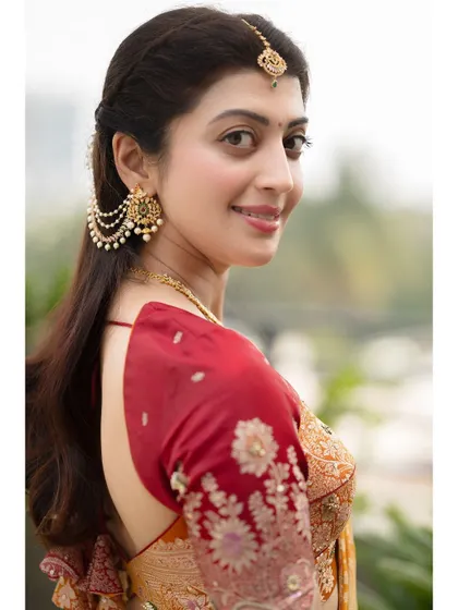 Another angle from the same series, capturing a gentle smile. This shows a softer, more approachable side of the traditional look.