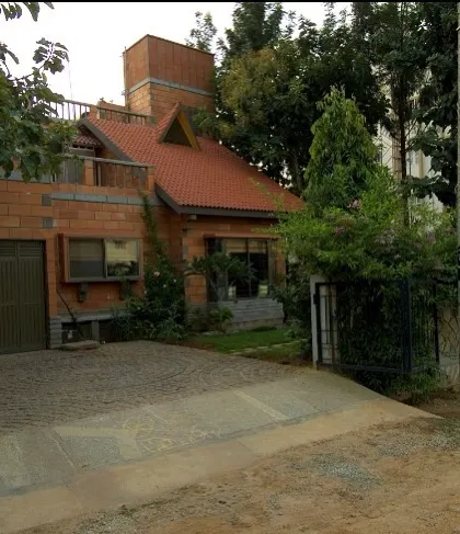 The Sharada Residence in Whitefield, completed in 2001, is an early example of our commitment to sustainable, earth-based architecture. The home's brick structure and tiled roof are designed to harmonize with the surrounding landscape.