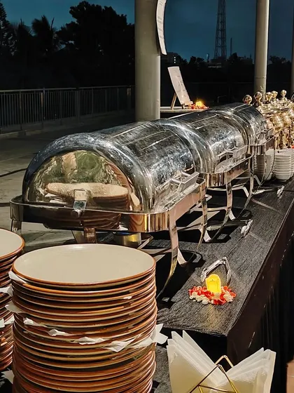 A wide shot of our buffet line at dusk, with chafing dishes ready for an evening meal. We are equipped to handle events at any time of day.