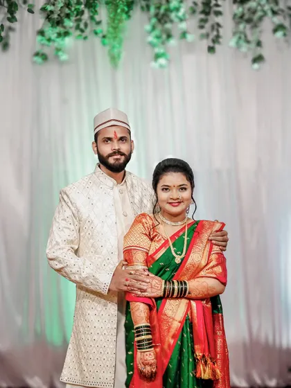 A traditional portrait of a newly engaged couple in Maharashtrian attire.