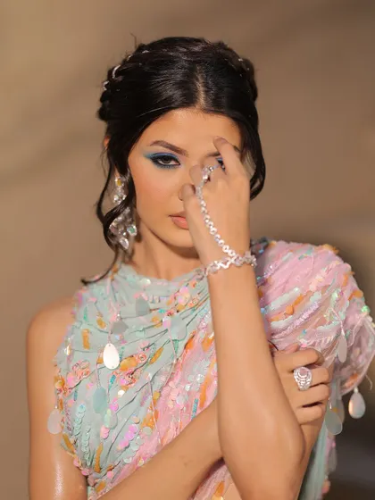 Beauty in a blink. This carnival-inspired look plays with pastel blues and pinks for a fun, colourful, and creative eye makeup statement.