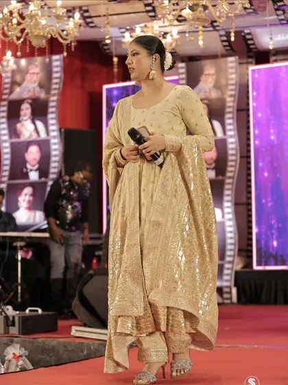 A full-length shot of my elegant, shimmering outfit for a celebratory evening, ready to take the stage.