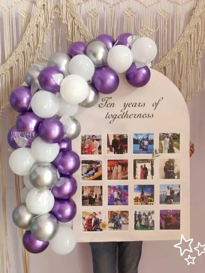 Ten years of togetherness celebrated with a custom photo memory board. This unique gift combines a balloon arch with a collage of the couple's favorite pictures from the last decade.
