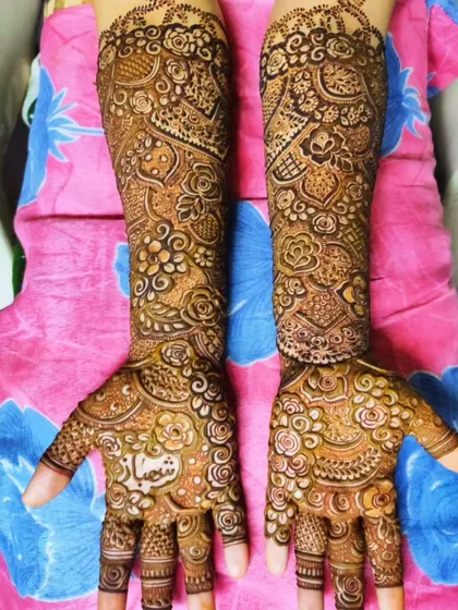 A personalized design with the name 'Shifa' on the palm, surrounded by delicate floral work.