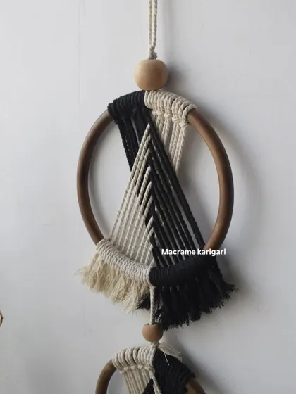 A close-up of the top ring of our 'Ringoz' wall hanging, showing the clean lines and contrasting colors of the design.