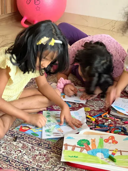 A candid shot of our little artists completely engrossed in their work. We create a relaxed environment where kids feel free to express themselves.