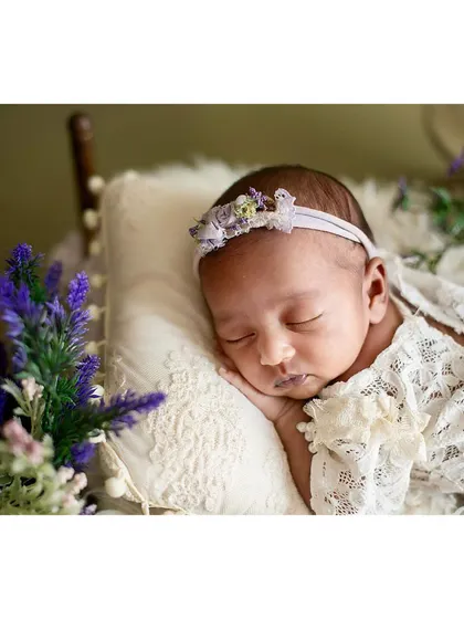 Another beautiful angle of the lavender floral newborn setup, showcasing the lace swaddle.