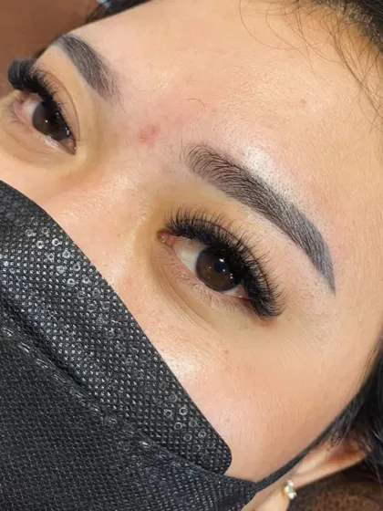 A double-duty transformation. This client got her eyebrows microbladed and a fresh set of lash extensions for a complete eye makeover.