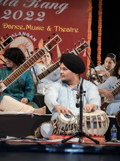 Looking towards the lead artist, Pt. Ravi Chary ji, for cues. This constant interaction is key to a tight performance.