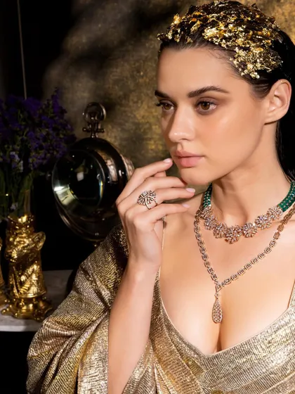 A stunning portrait from the IGI shoot, with a golden theme and dramatic lighting to create a look of pure luxury.