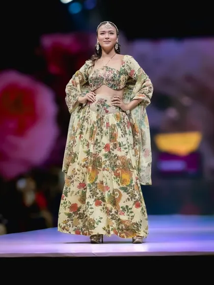 This floral lehenga presents a softer, more romantic aesthetic on the runway. I captured it straight on to showcase the beautiful print and the classic, elegant silhouette of the design.