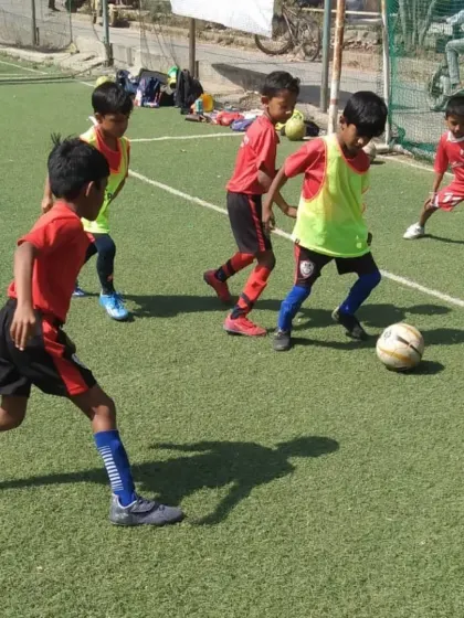 A snapshot of a game during our grassroots training, where the focus is on participation and having fun.