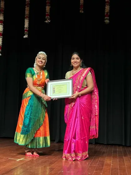 A moment of pride for both the Guru and Sishya. This photograph captures the beautiful bond that is forged through years of shared hard work and dedication to the art of Bharatanatyam.