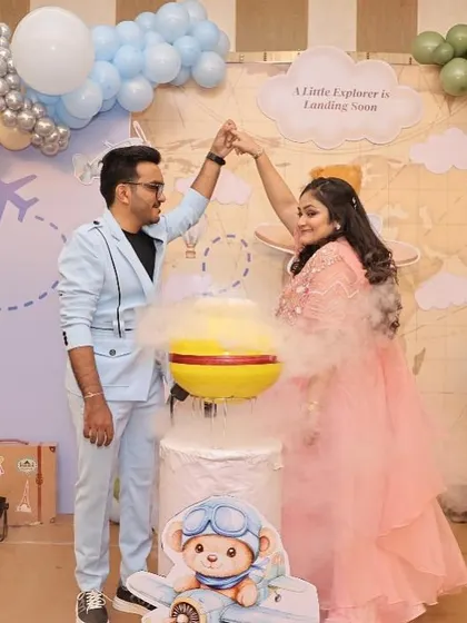 A magical gender reveal moment at the travel-themed shower, where a balloon pop reveals the baby's gender.