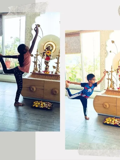 Two little yogis, one in a Captain America shirt, offer their practice to the divine. This shows that yoga is for everyone, blending modern childhood with timeless traditions.