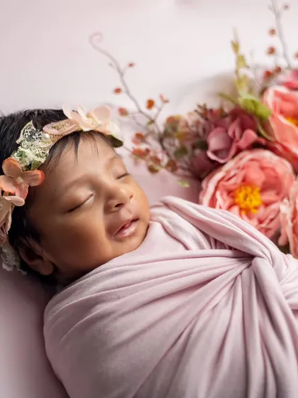 A sweet smile in her sleep. We are always ready to capture these fleeting, precious expressions that happen in a blink of an eye.