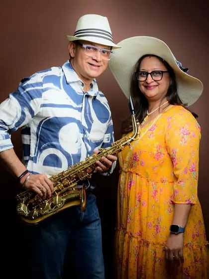 Another creative shot from the anniversary session, this time with a saxophone and hats. It's all about having fun and letting the couple's personality shine.