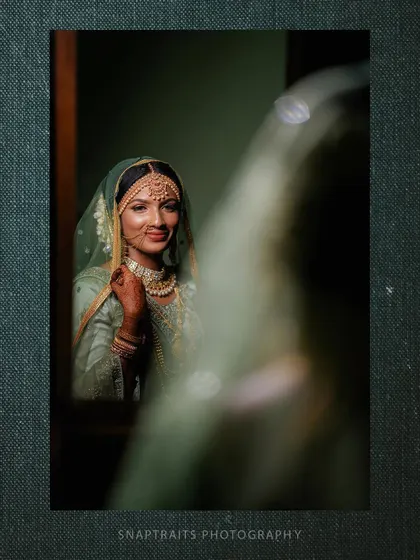 An artistic portrait of the bride seen through her reflection, creating a sense of depth and mystery.