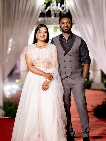 A lovely photo of the happy couple at their reception. For the bride, I created a soft, ethereal look with shimmery eyes and a natural base to match her beautiful white lehenga.