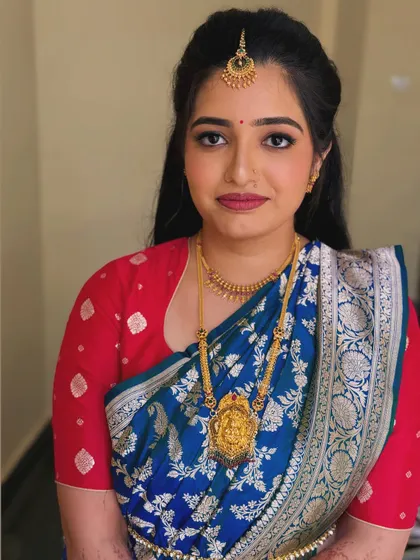 Another portrait of Navya, showing the complete look with her beautiful blue silk saree.