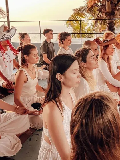 An instructor anoints students' foreheads with a tilak during the opening ceremony, a traditional gesture of blessing and welcome.