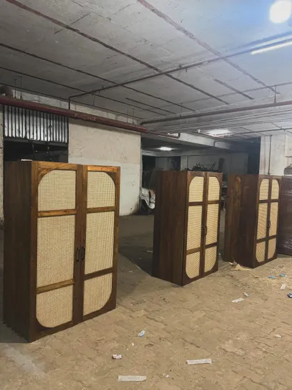A lineup of the finished wardrobes, showcasing the consistent quality of a large order.