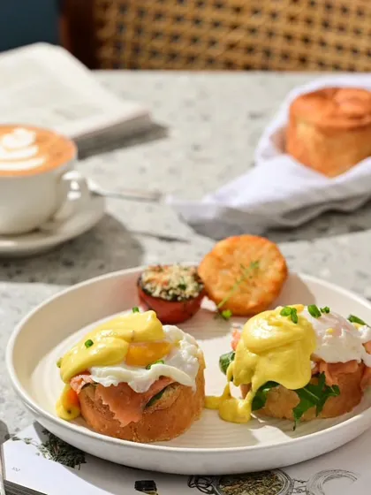 My weekend breakfast affair includes classics like Eggs Benedict, served with hash browns and grilled tomato.