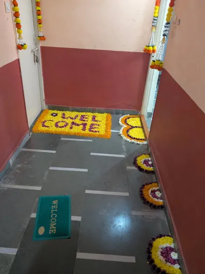 Another example of a flower rangoli welcome mat, perfect for adding a touch of tradition and color to the entrance of your home.