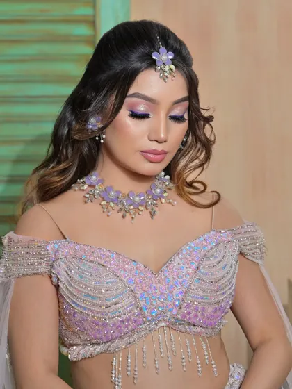 Another serene portrait, giving a clear view of the details on the floral choker.