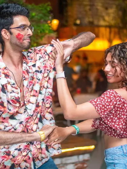 A stylish couple enjoying the Holi festivities on the dance floor. The energy was absolutely electric.