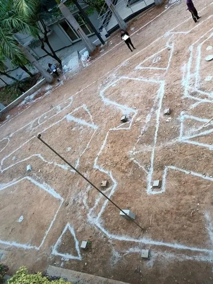 A behind-the-scenes look at the initial phase of the Atria University project. The design is marked out with chalk on the ground, showing the meticulous planning that goes into executing a large-scale landscape.