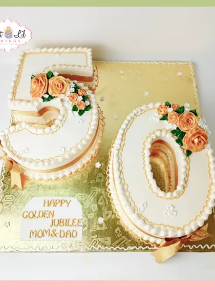 A classic and elegant number cake for a 50th golden jubilee anniversary. The "50" is beautifully piped and decorated with delicate orange roses.