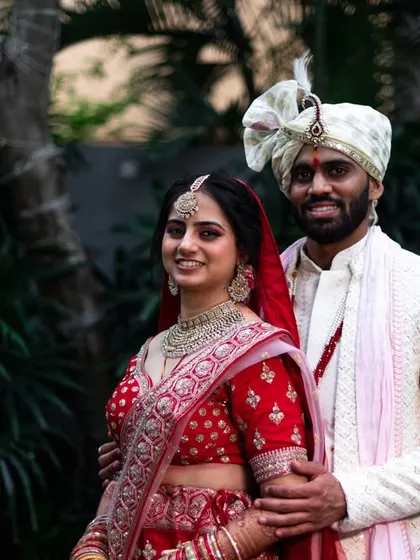 A classic portrait of a smiling couple in their wedding attire. This is a timeless shot that every family loves to have.