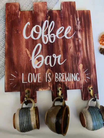 The "Coffee Bar" sign is a must-have for anyone who takes their morning brew seriously. It's both a decorative sign and a practical holder for your favorite mugs.