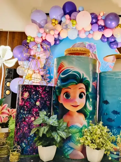 A close-up on the custom-printed pedestals, featuring mermaid characters that perfectly match the party's theme.
