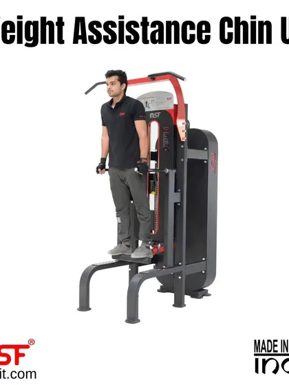 A user at the starting position for a chin-up on the weight-assisted machine.