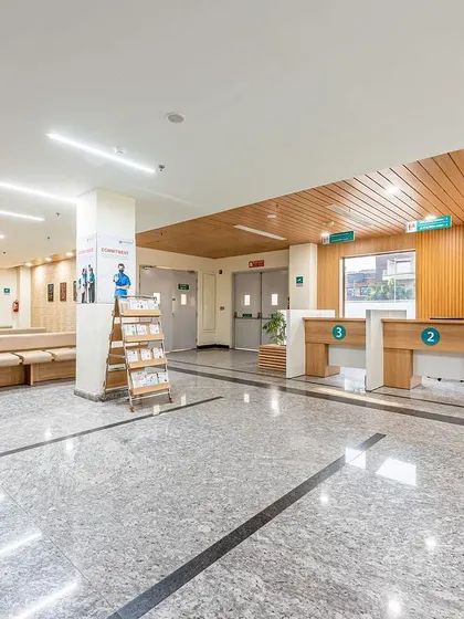 The registration area at Sarvesh Health City is clean, organized, and functional. The use of wood paneling and clear numbering for counters ensures an efficient and welcoming experience for patients.