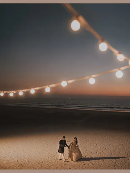 A romantic shot of a couple on the beach at sunset during their Sangeet in Goa. We help plan the event flow to make time for these beautiful moments.