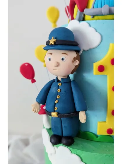 Officer Plod stands at attention. It's important to get the proportions right so each figurine fits perfectly on the cake.