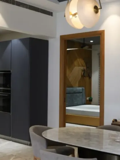 This view shows the open kitchen and dining area on the first floor of the Screen House, with a glimpse into the parents' bedroom. The layout is designed to promote connection and easy interaction.