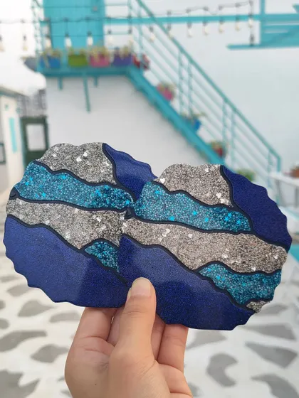 A customer requested this vibrant set of blue and silver glitter coasters. The wavy, layered design reminds me of the ocean and adds so much sparkle.