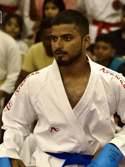 A blue belt student, focused and ready for his match. The gear is on, and the mind is sharp. This is what preparation looks like.