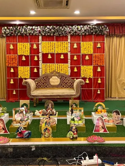 A platter display with a unique backdrop of yellow and red squares with temple bells.