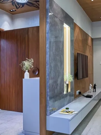 The entryway flows directly into the living area, with a custom-built console and accent wall defining the space. The design ensures that every part of the home feels connected and thoughtfully planned.