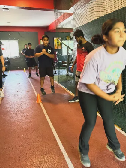 A group of young athletes performs jumping drills, developing explosive power and coordination.