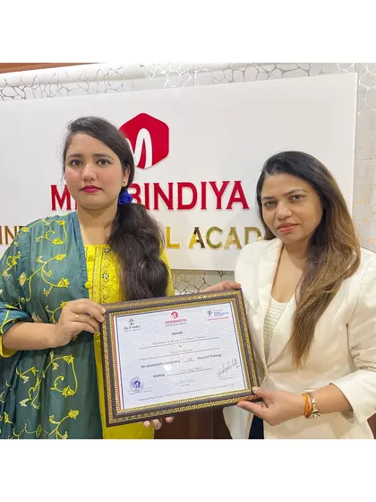 A smile of accomplishment. This graduate has worked hard and is now ready to start her career as a certified professional.